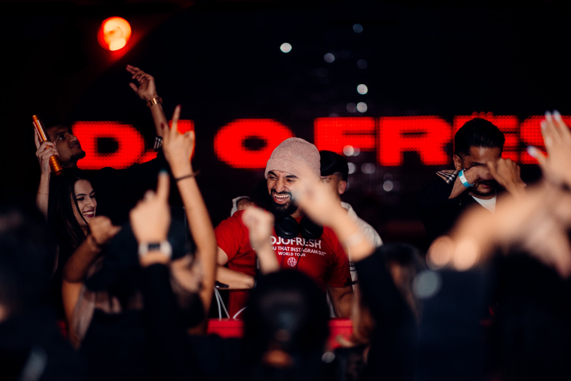 DJ O Fresh in the crowd with LED backdrop